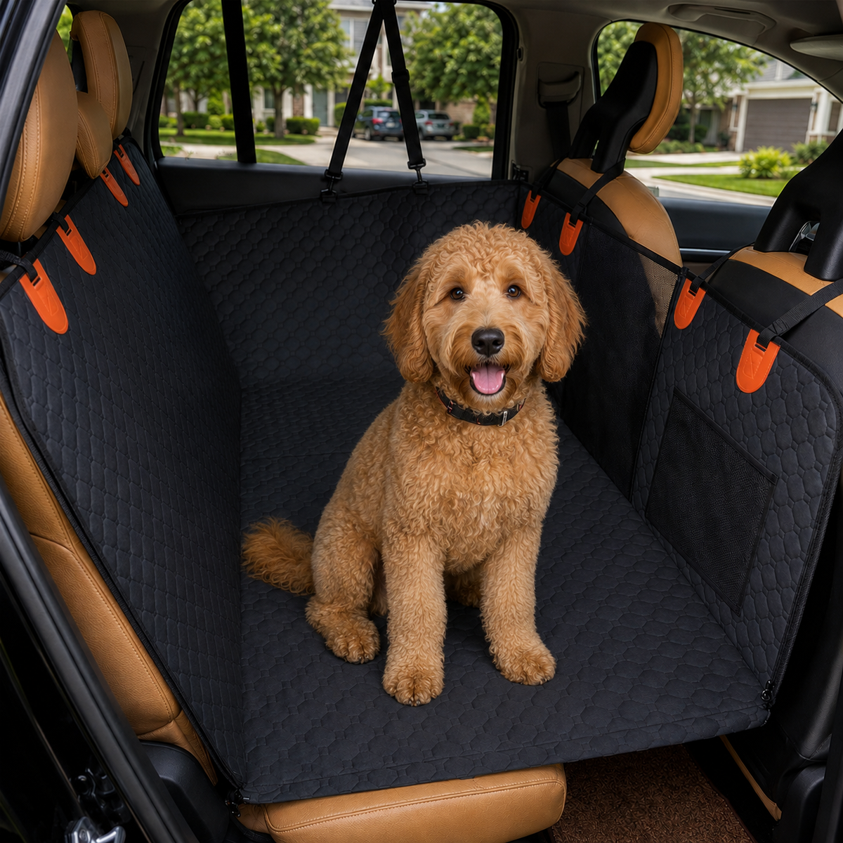 Golden doodle sitting on a black quilted RoadGuard hard bottom dog car seat cover installed across a car back seat